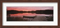 Canoe tied to dock on a small lake at sunset, Sweden Fine Art Print
