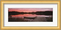 Canoe tied to dock on a small lake at sunset, Sweden Fine Art Print