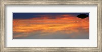 Reflection of clouds with circular ripples spreading outward across glassy lake waters at sunset Fine Art Print