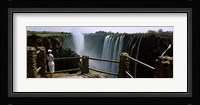 Woman looking at the Victoria Falls from a viewing point, Zambia Fine Art Print