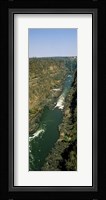 Kayakers paddle down the Zambezi gorge away from the Victoria Falls, Zambia Fine Art Print