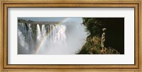 Woman looking at a rainbow over the Victoria Falls, Zimbabwe Fine Art Print