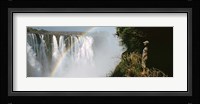 Woman looking at a rainbow over the Victoria Falls, Zimbabwe Fine Art Print