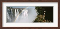 Woman looking at a rainbow over the Victoria Falls, Zimbabwe Fine Art Print