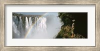 Woman looking at a rainbow over the Victoria Falls, Zimbabwe Fine Art Print