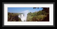 Tourists at a viewing point looking at the rainbow formed over Victoria Falls, Zimbabwe Fine Art Print