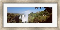 Tourists at a viewing point looking at the rainbow formed over Victoria Falls, Zimbabwe Fine Art Print