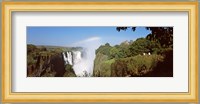 Tourists at a viewing point looking at the rainbow formed over Victoria Falls, Zimbabwe Fine Art Print