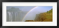 Rainbow form in the spray created by the water cascading over the Victoria Falls, Zimbabwe Fine Art Print