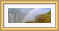 Rainbow form in the spray created by the water cascading over the Victoria Falls, Zimbabwe Fine Art Print