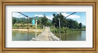 Old wooden bridge across the river, Chiang Mai Province, Thailand Fine Art Print