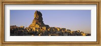 Low angle view of a rock formation in a village, Cappadocia, Turkey Fine Art Print