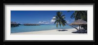 Lounge chair under a beach umbrella, Moana Beach, Bora Bora, French Polynesia Fine Art Print