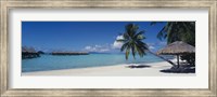 Lounge chair under a beach umbrella, Moana Beach, Bora Bora, French Polynesia Fine Art Print