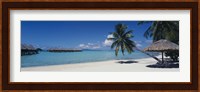 Lounge chair under a beach umbrella, Moana Beach, Bora Bora, French Polynesia Fine Art Print