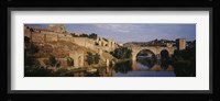 Castle at the waterfront, Puente de San Martin, Tajo River, Toledo, Spain Fine Art Print