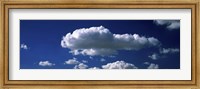 Fluffy clouds in blue sky Fine Art Print