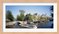 Netherlands, Amsterdam, tour boat in channel Fine Art Print