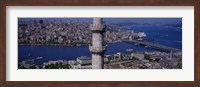 Mid section view of a minaret with bridge across the bosphorus in the background, Istanbul, Turkey Fine Art Print