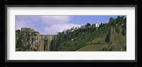 Low angle view of a town, Tajo Bridge, Rio Guadalevin Gorge, Serrania De Ronda, Ronda, Andalusia, Spain Fine Art Print