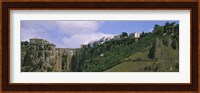 Low angle view of a town, Tajo Bridge, Rio Guadalevin Gorge, Serrania De Ronda, Ronda, Andalusia, Spain Fine Art Print