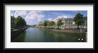 Buildings along a canal, Haarlem, Netherlands Fine Art Print