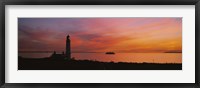 Silhouette of a lighthouse at sunset, Scotland Fine Art Print