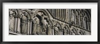 Low angle view of statues carved on wall of a cathedral, Trondheim, Norway Fine Art Print