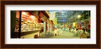 Group of people sitting outside a restaurant, Beijing, China Fine Art Print