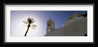 Low angle view of a palm tree near a church , Ios, Cyclades Islands, Greece Fine Art Print