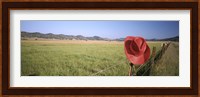 USA, California, Red cowboy hat hanging on the fence Fine Art Print