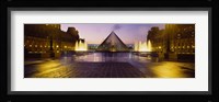 Museum lit up at night with ghosted image of three men, Louvre Museum, Paris, France Fine Art Print