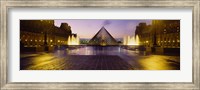 Museum lit up at night with ghosted image of three men, Louvre Museum, Paris, France Fine Art Print