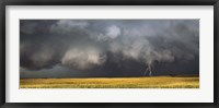 Thunderstorm advancing over a field Framed Print