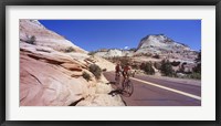 Two people cycling on the road, Zion National Park, Utah, USA Fine Art Print