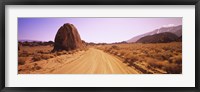 Dirt road passing through an arid landscape, Californian Sierra Nevada, California, USA Fine Art Print