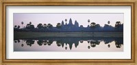 Reflection of temples and palm trees in a lake, Angkor Wat, Cambodia Fine Art Print