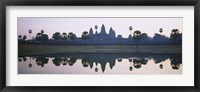 Reflection of temples and palm trees in a lake, Angkor Wat, Cambodia Fine Art Print