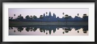 Reflection of temples and palm trees in a lake, Angkor Wat, Cambodia Fine Art Print