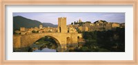 Arch bridge across a river in front of a city, Besalu, Catalonia, Spain Fine Art Print