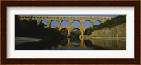 Reflection of an arch bridge in a river, Pont Du Gard, France Fine Art Print