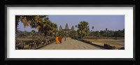 Two monks walking in front of an old temple, Angkor Wat, Siem Reap, Cambodia Fine Art Print