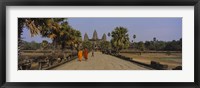 Two monks walking in front of an old temple, Angkor Wat, Siem Reap, Cambodia Fine Art Print