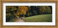 Group of people walking on a walkway in a park, St. Peter, Black Forest, Baden-Wurttemberg, Germany Fine Art Print