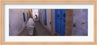 Rear view of a woman walking on the street, Medina, Kairwan, Tunisia Fine Art Print