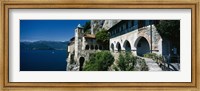 Walkway along a building at a lake, Santa Caterina del Sasso, Lake Maggiore, Piedmont, Italy Fine Art Print