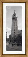 Group of people walking near a church, La Giralda, Seville Cathedral, Seville, Seville Province, Andalusia, Spain Fine Art Print