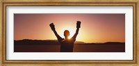 Silhouette of a person wearing boxing gloves in a desert at dusk, Black Rock Desert, Nevada, USA Fine Art Print