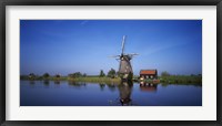 Reflection of a traditional windmill in a lake, Netherlands Fine Art Print