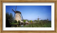 Traditional windmills in a field, Netherlands Fine Art Print